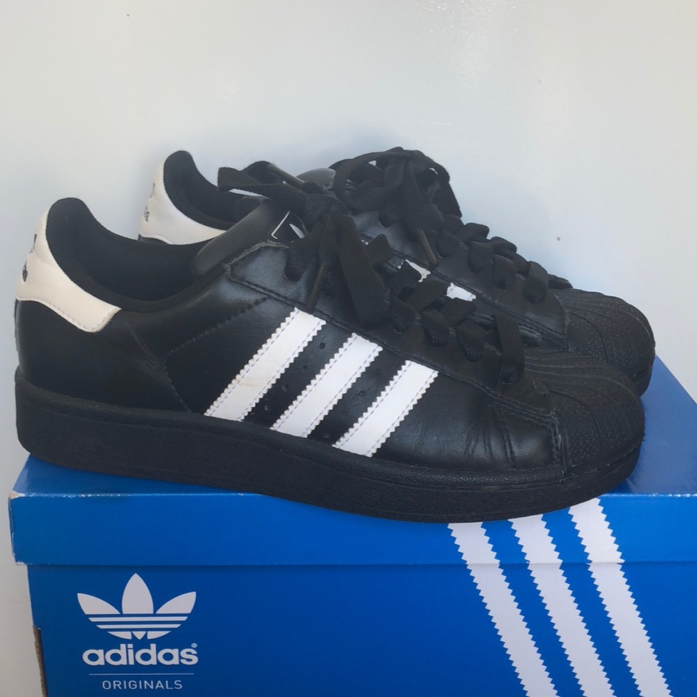 Black and white shell toes Adidas